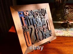 35 pcs. Vintage/antique letterpress in a stained wood frame with brown stand