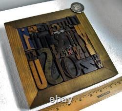 35 pcs. Vintage/antique letterpress in a stained wood frame with brown stand