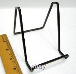 35 pcs. Vintage/antique letterpress in a stained wood frame with brown stand