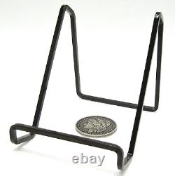 36 pcs. Vintage/antique letterpress in stained wood frame with square iron stand