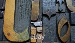 36 pcs. Vintage/antique letterpress in stained wood frame with square iron stand
