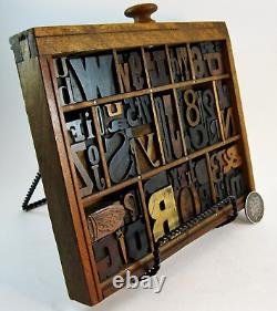 64 pcs. Vintage/antique letterpress in a section of type case with stand. Nice