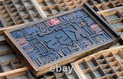 Collage KISS made of letterpress wood type characters in antique drawer old