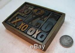 Great old letterpress wood type Xs and Os in a small case. Beautiful old type