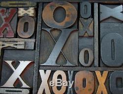 Great old letterpress wood type Xs and Os in a small case. Beautiful old type
