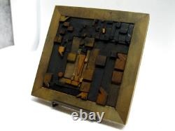 Vintage/antique letterpress punctuation marks in stained wood frame with stand