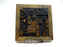 Vintage/antique letterpress punctuation marks in stained wood frame with stand