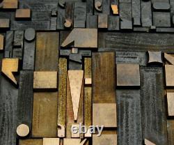 Vintage/antique letterpress punctuation marks in stained wood frame with stand
