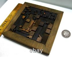 Vintage/antique letterpress punctuation marks in stained wood frame with stand